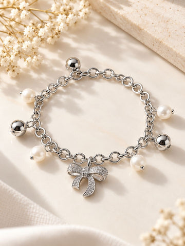 Silver-Toned Bow Charm Pearl Bracelet