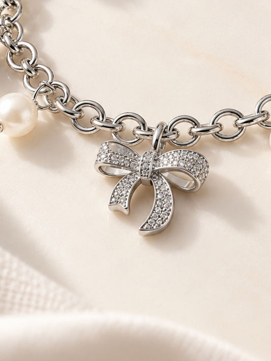 Silver-Toned Bow Charm Pearl Bracelet